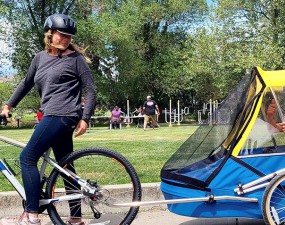 Mom, Karen and 22-year-old Kai try out one of the new adult bike trailers now available 